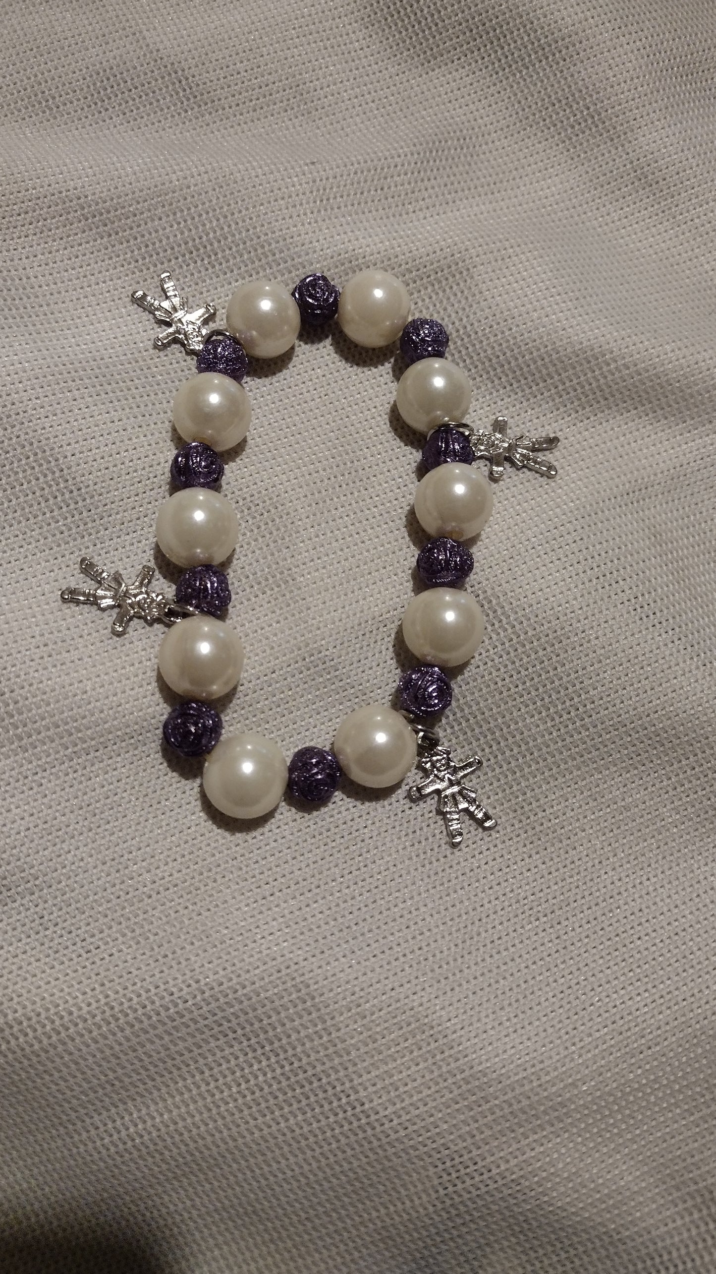 Women's cream/purple charm stretch bracelet